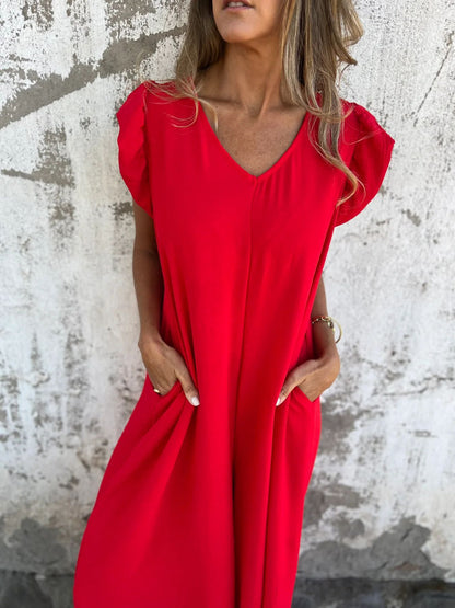 Kombinezon z dekoltem w panterkę i kieszeniami z przodu